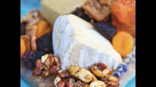 cheese board with honey-herb candied nuts