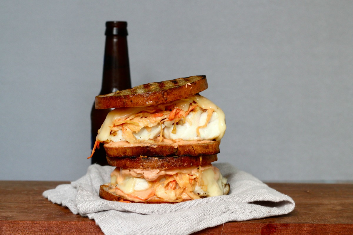 grilled grouper reuben sandwich and bottle of beer