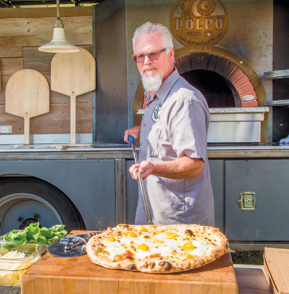 Taking Pizza out of Oven