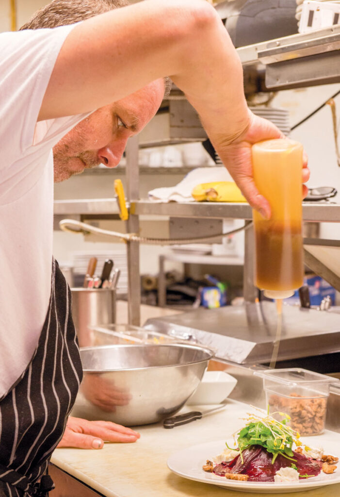 Chef Andy plating his Beet Salad with Truffle Honey